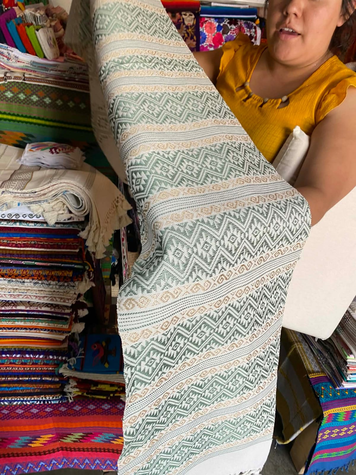Intricate geometric pattern woven on a traditional Zapotec loom