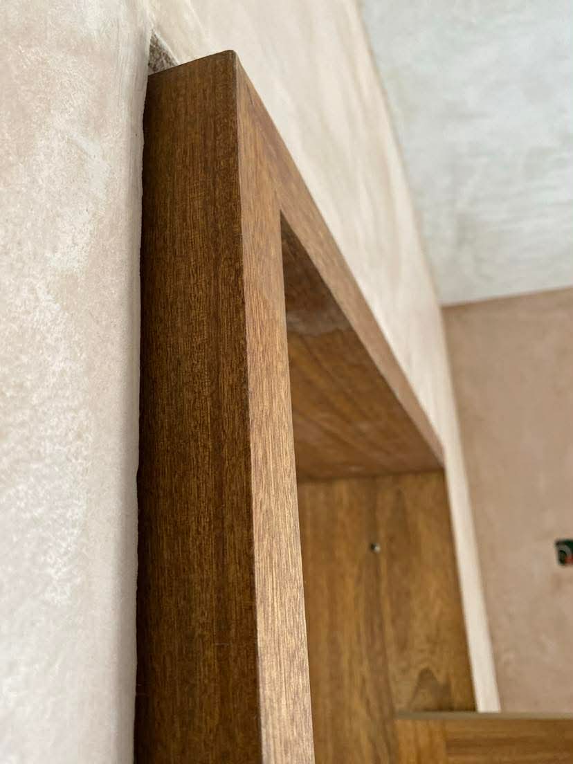 Macuil wood door frame showing dense grain and warm tones