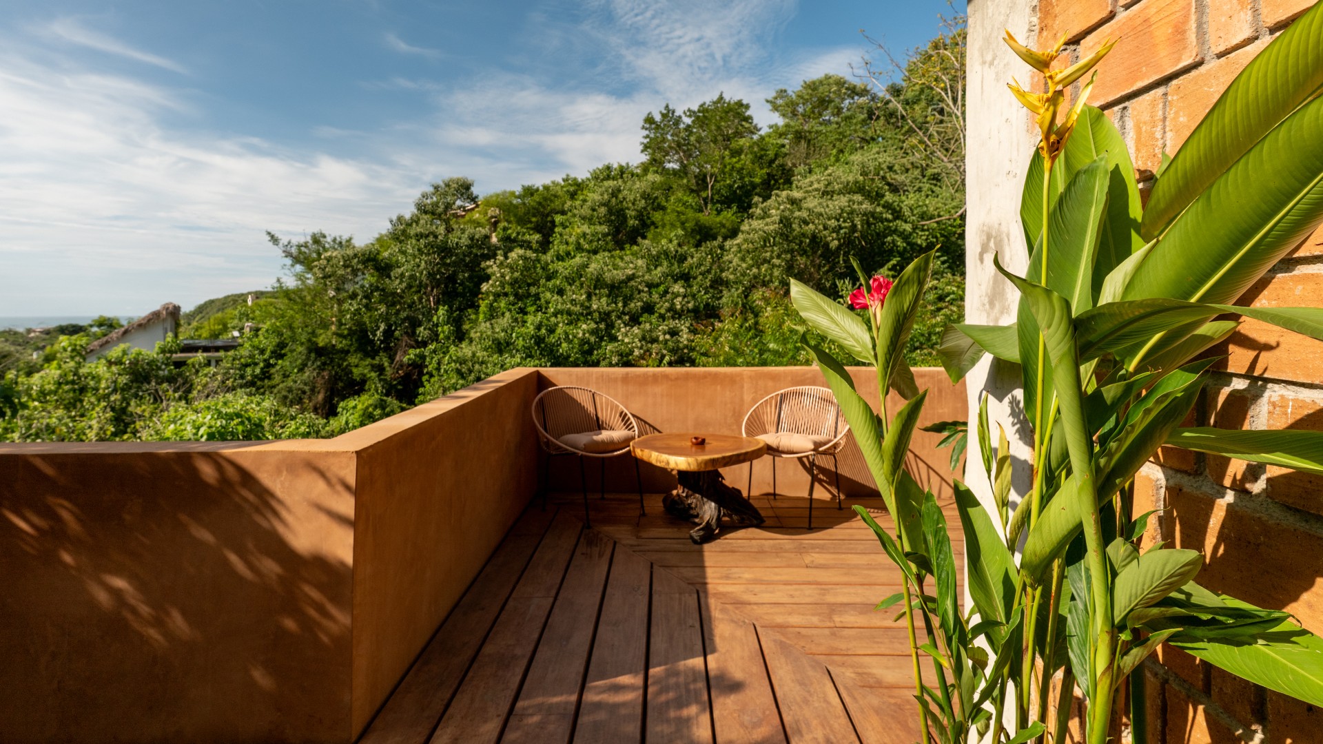 View from a Casa Maradi terrace overlooking the Mazunte hillside toward the ocean