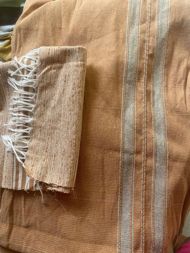 Hand-woven cotton textiles in warm terracotta tones